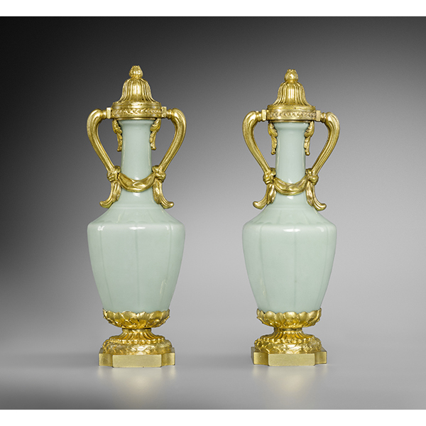 A pair of Chinese celadon covered vases