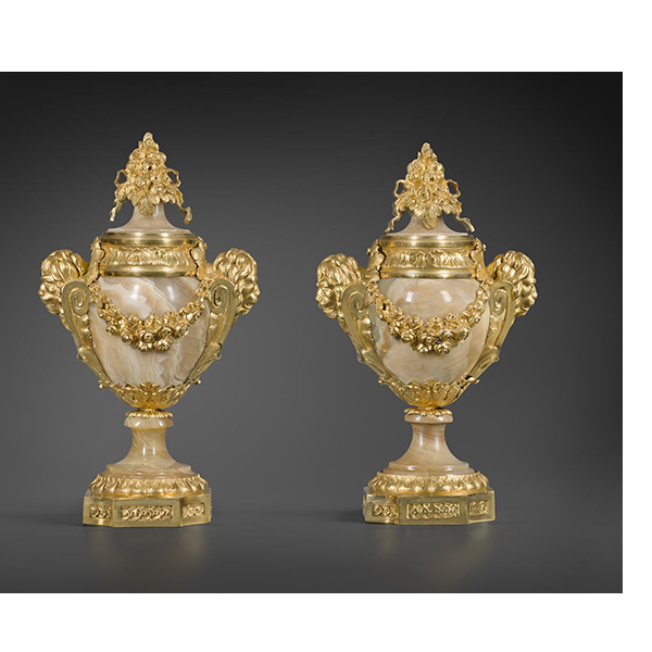 A pair of late Louis XV gilt bronze-mounted onyx vases, the handles in the form of lion’s masks