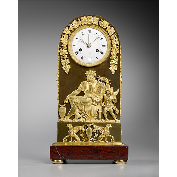A mantel clock representing Anacreon playing the lyre