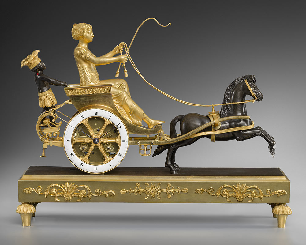 Une-pendule-en-bronze-ciselé,-doré-et-patiné,-représentant-une-jeune-femme-de-la-Louisiane