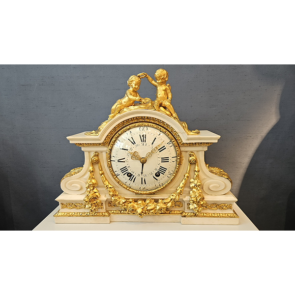 A white marble mantel clock attributed to Robert Osmond
